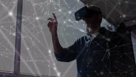 Animation-of-network-of-connections-over-man-wearing-vr-headset