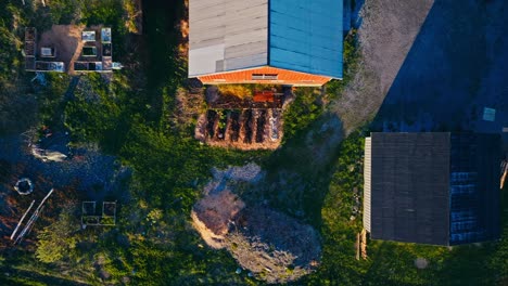 descending on the yard with garden plants growing. aerial shot