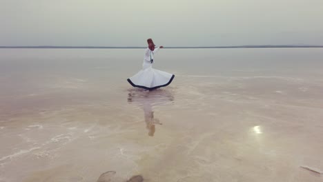 sunset and whirling at the sea, sufi. sufi whirling (turkish: semazen)