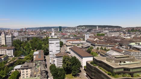 Drone-flyover-shot-over-the-city-of-Zürich-in-Switzerland-towards-Prime-Tower-on-a-hot-summer-day