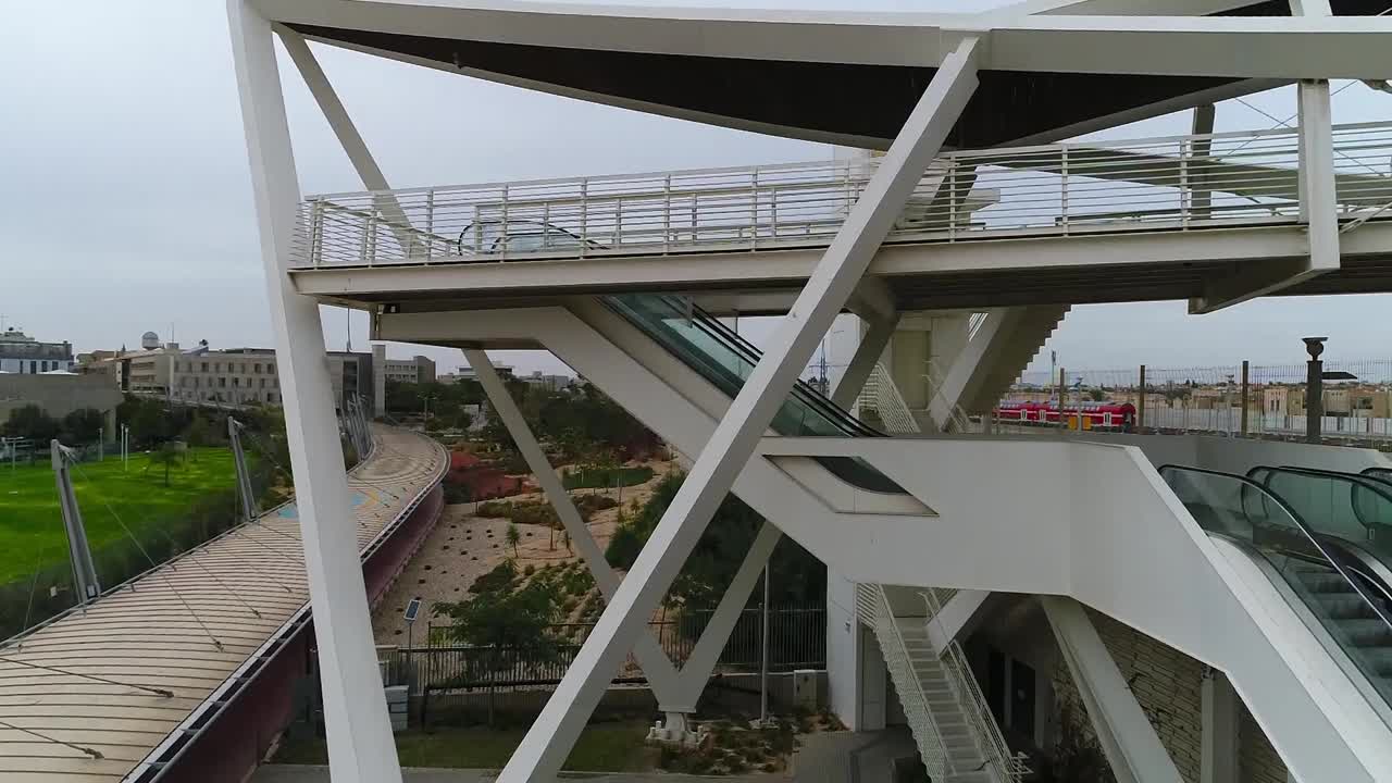 Aerial drone shot of a bridge in a railway area. On a sunny day.