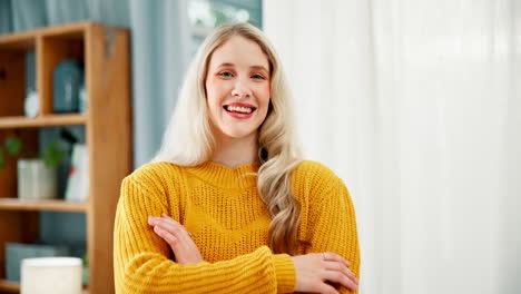 portrait of a smiling woman with blonde hair wearing a yellow sweater