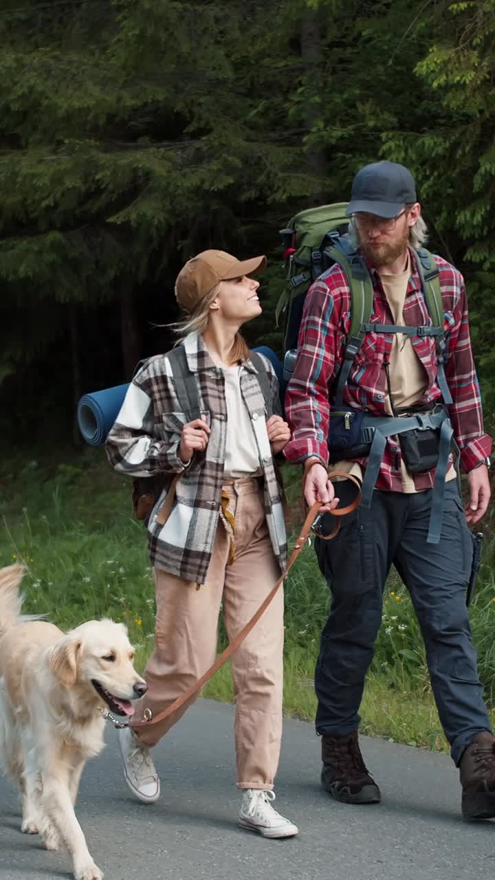 Couple Hiking with Dog in Forest