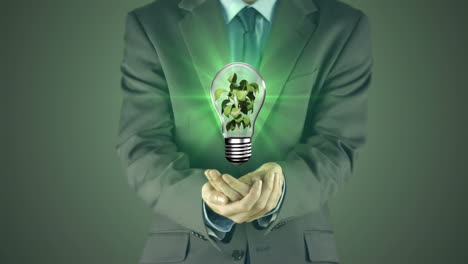 businessman presenting light bulb with hands