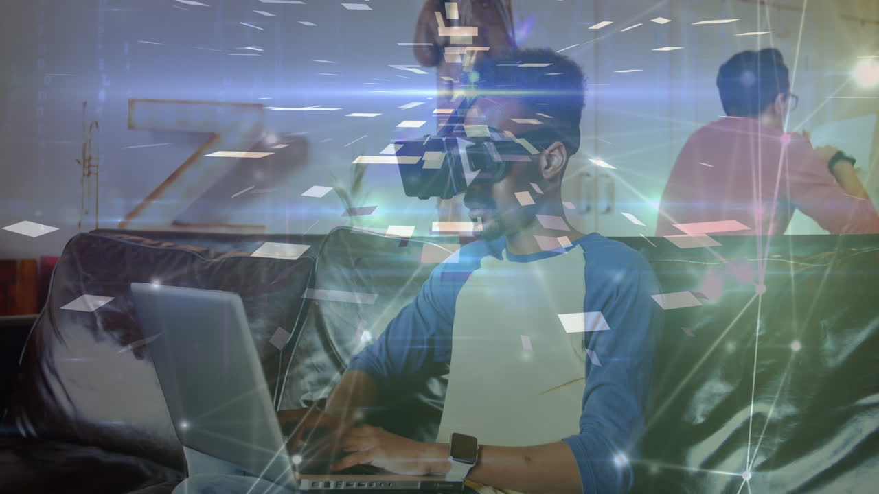 Animation of glowing network of connections over man in office using computer and vr headset