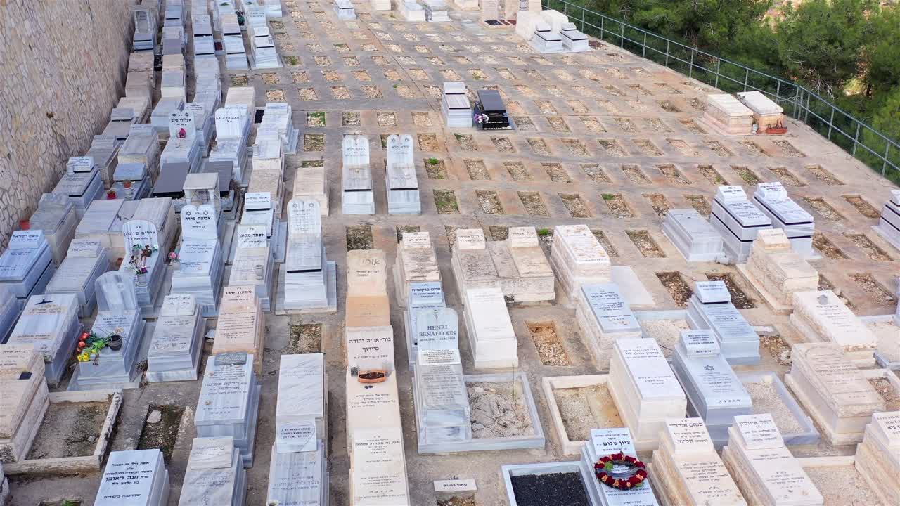 A Panoramic View of a Cemetery on a Verdant Hillside