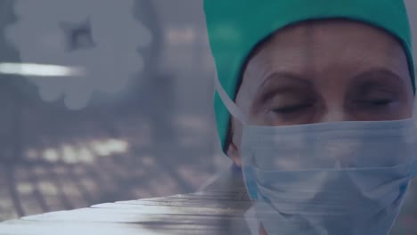 Portrait-of-female-surgeon-wearing-face-mask-against-time-lapse-of-people-walking