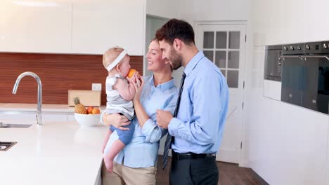 Happy-parents-playing-with-their-baby