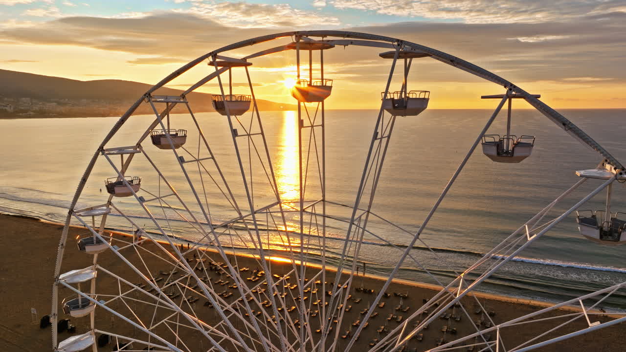 Aerial drone view of a ferris wheel Sunny Beach resort in Bulgaria at sunset