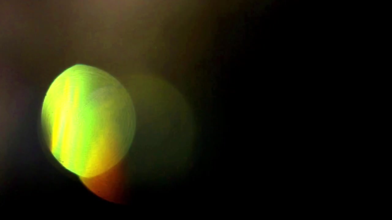 Abstract Light Leaks and Bokeh Effects on Black Background
