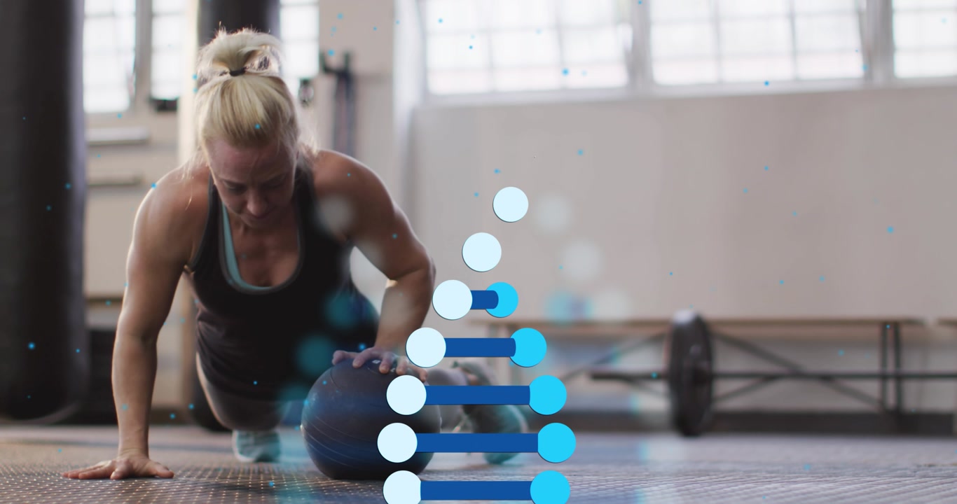 Female athlete starting plank by gripping medicine ball and alternating rolls for fitness balance