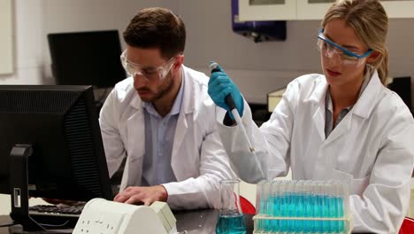 two scientists doing a chemical experiment