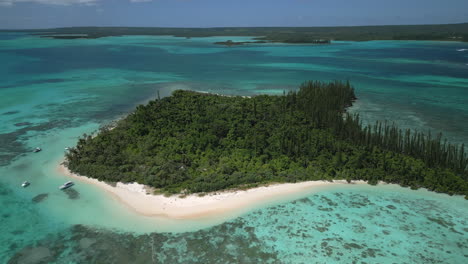 orbiting aerial view of ilot moro - part of the isle of pines archipelago