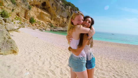 two attractive young women bonding on the beach