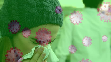 coronavirus spreading over woman sneezing.