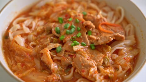 korean udon ramen noodles with pork in kimchi soup - asian food style