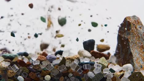 captivating close-up of colorful sand and gravel in motion underwater, showcasing the intricacies of textures and patterns in a dynamic liquid environment