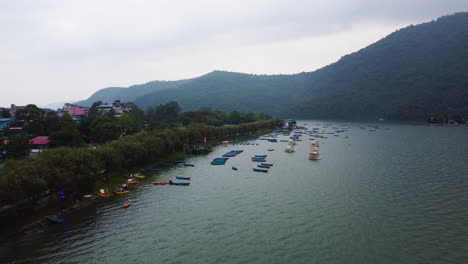 aerial view of colorful boats on phewa lake, a lake in pokhara, nepal