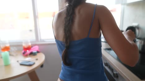 close-up of a woman in a blue tank top