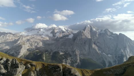 epic slowmotion aerial of the italian dolomites covered in snow during sunset