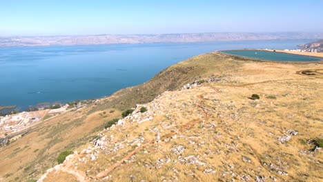 the beautiful rocky arbel cliff, overlooking the sea of galilee - low aerial