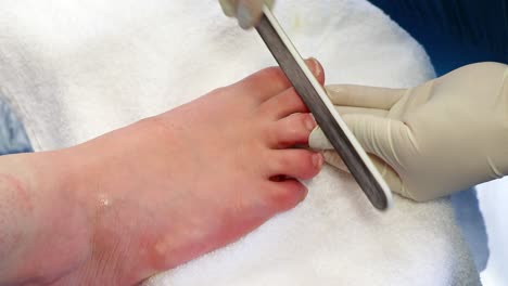 A-girl-has-her-toenails-polished-in-a-beauty-salon