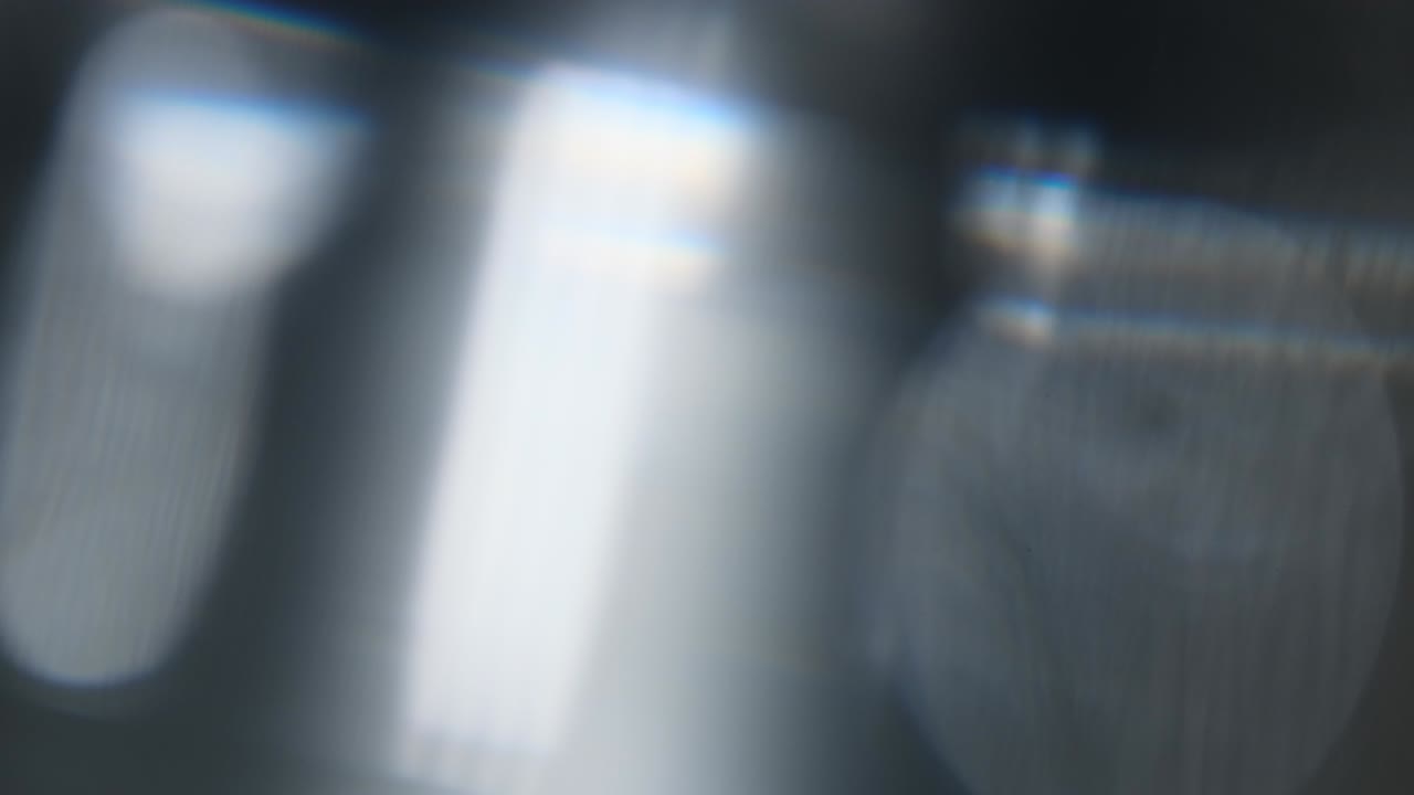 Abstract light leaks on black background.