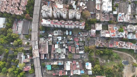 smooth drone pan across tightly packed housing in maduravoyal.
