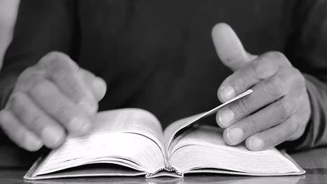 praying to god with hands on bible on table with people stock footage stock video