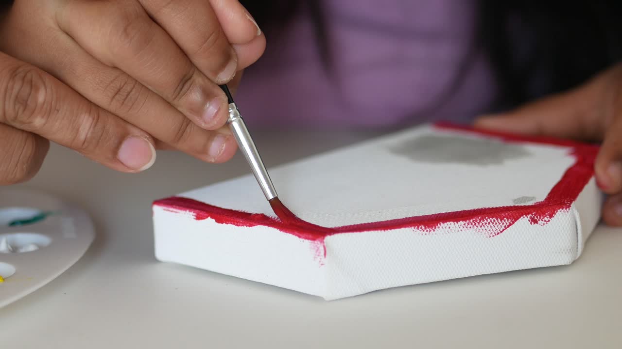 Child Painting a Small Canvas