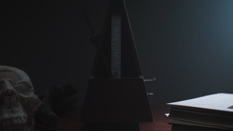 metronome set the rythm in the dark, old room