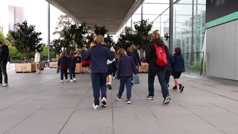 children walking towards museum entrance together