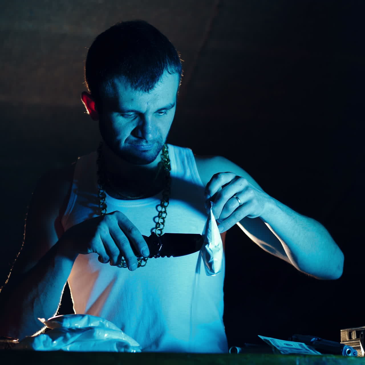 Brutal Drug Dealer Takes Packed Drug Brick out of the Suitcase and Cuts it with a Knife to try a Sample. Square video