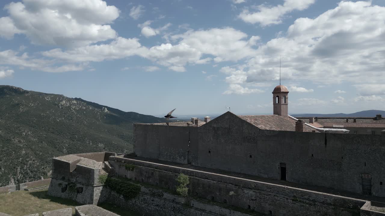 Drone is ascending over Fort Bellegarde, a historic fortress in Le Perthus, France
