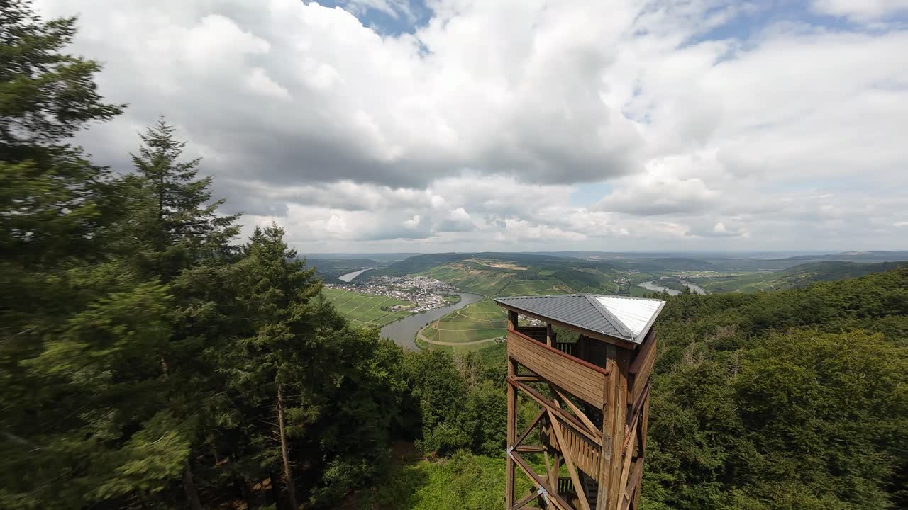 Panoramic view tower over the Moselle valley, Germany, with vineyards and waterway, FPV drone video