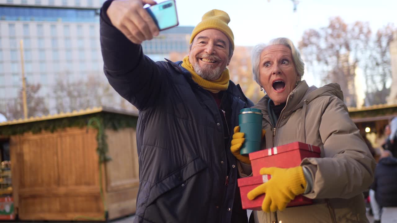 Senior Couple Taking Selfie with Gifts