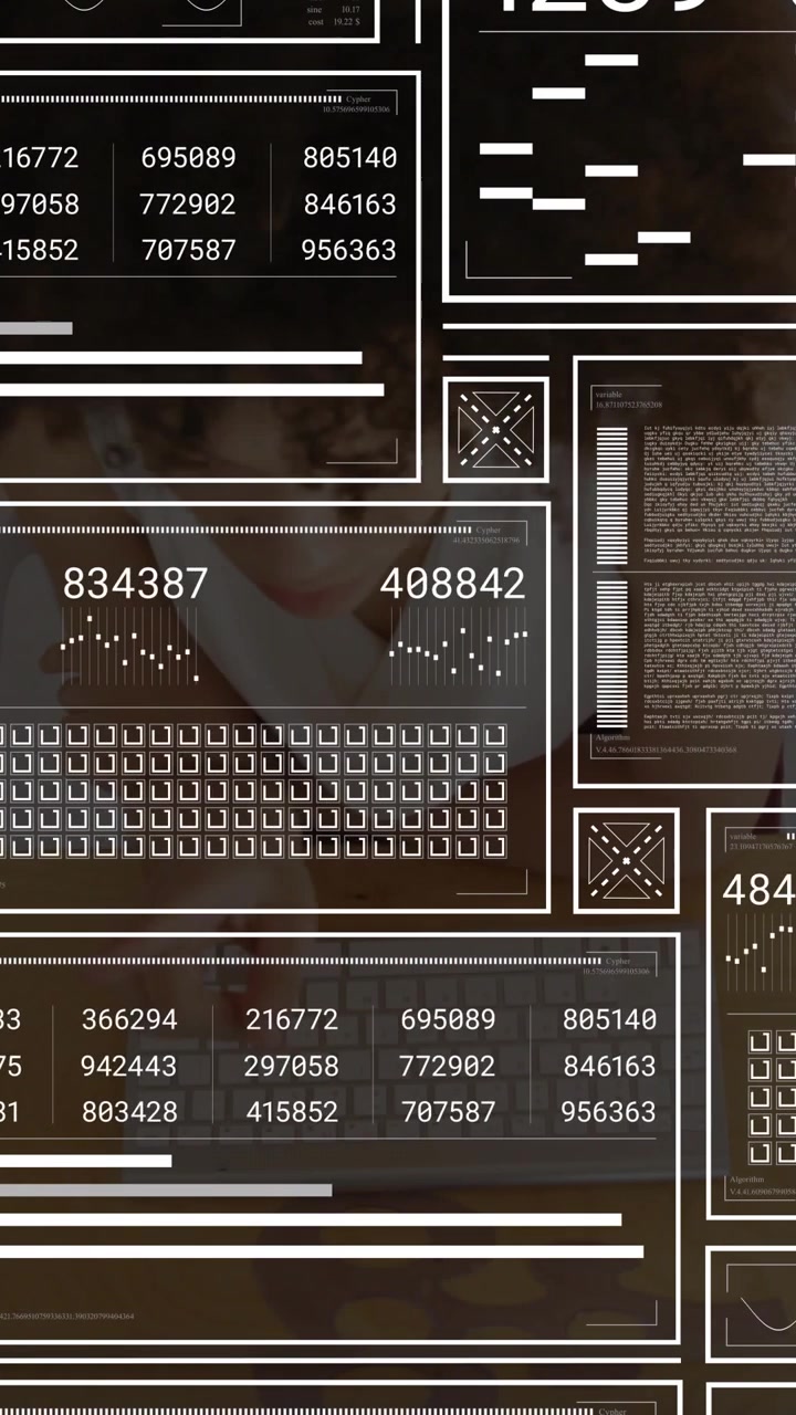 Vertical video: Woman typing on white keys on wood desk, updating data panels for analysis