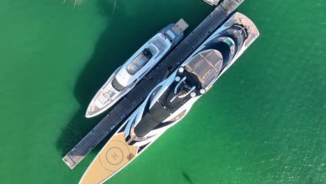 top down aerial view of the yachts at marina in miami