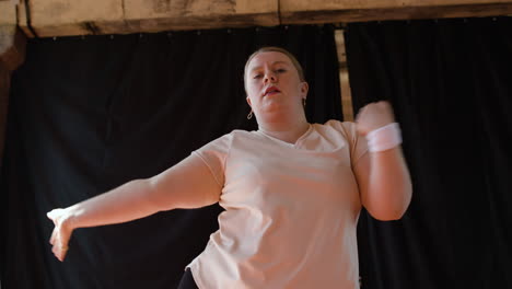 Woman-dancing-indoors