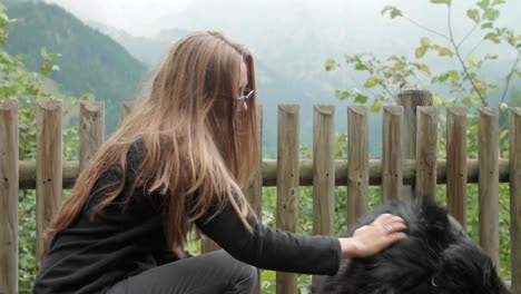 woman embraces her dog