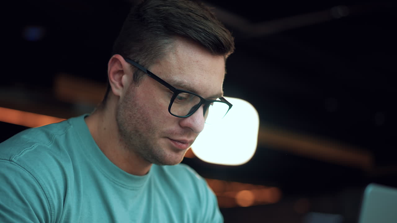 Man Working on Laptop in Office