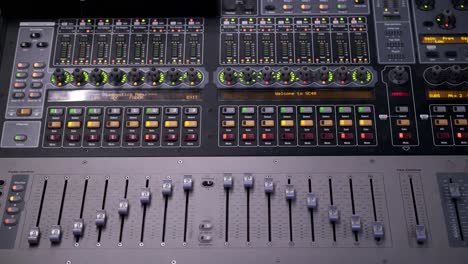 A-Colorful-Sound-Music-Mixer-Adjusting-Volume-Faders-Rapidly-and-Flashing-Blinking-Lights