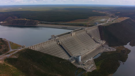 aerial view of a large hydroelectric dam and reservoir
