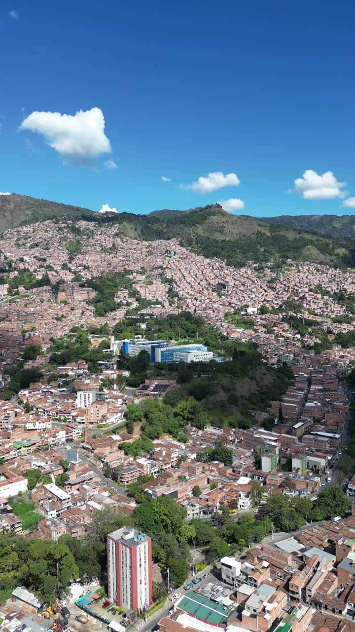 Experience Medellín, Colombia, through an aerial view capturing its vibrant cityscape, surrounded by the majestic Andes Mountains and lush greenery. Perfect for cultural and travel-focused projects.