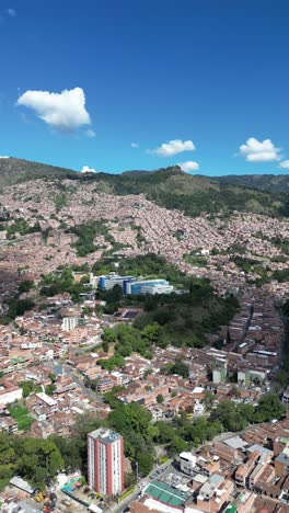 experience medellín, colombia, through an aerial view capturing its vibrant cityscape, surrounded by the majestic andes mountains and lush greenery. perfect for cultural and travel-focused projects.