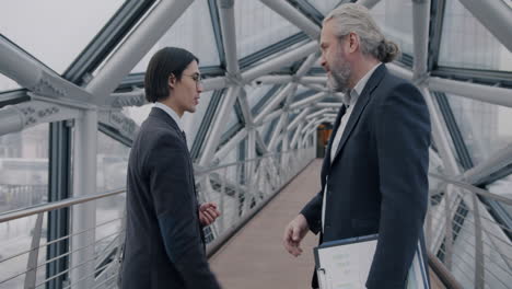 businessmen meeting on a modern bridge