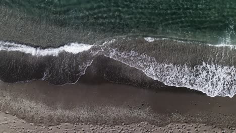 top down view of sea waves on the beach