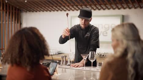 bartender making cocktails at a bar