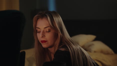 woman in bedroom at night