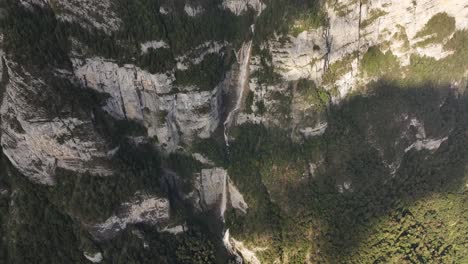 seerenbachfälle waterfall plunging down towering cliffs into dense forest near amden, betlis, weesen, walensee, kanton st. gallen, switzerland
